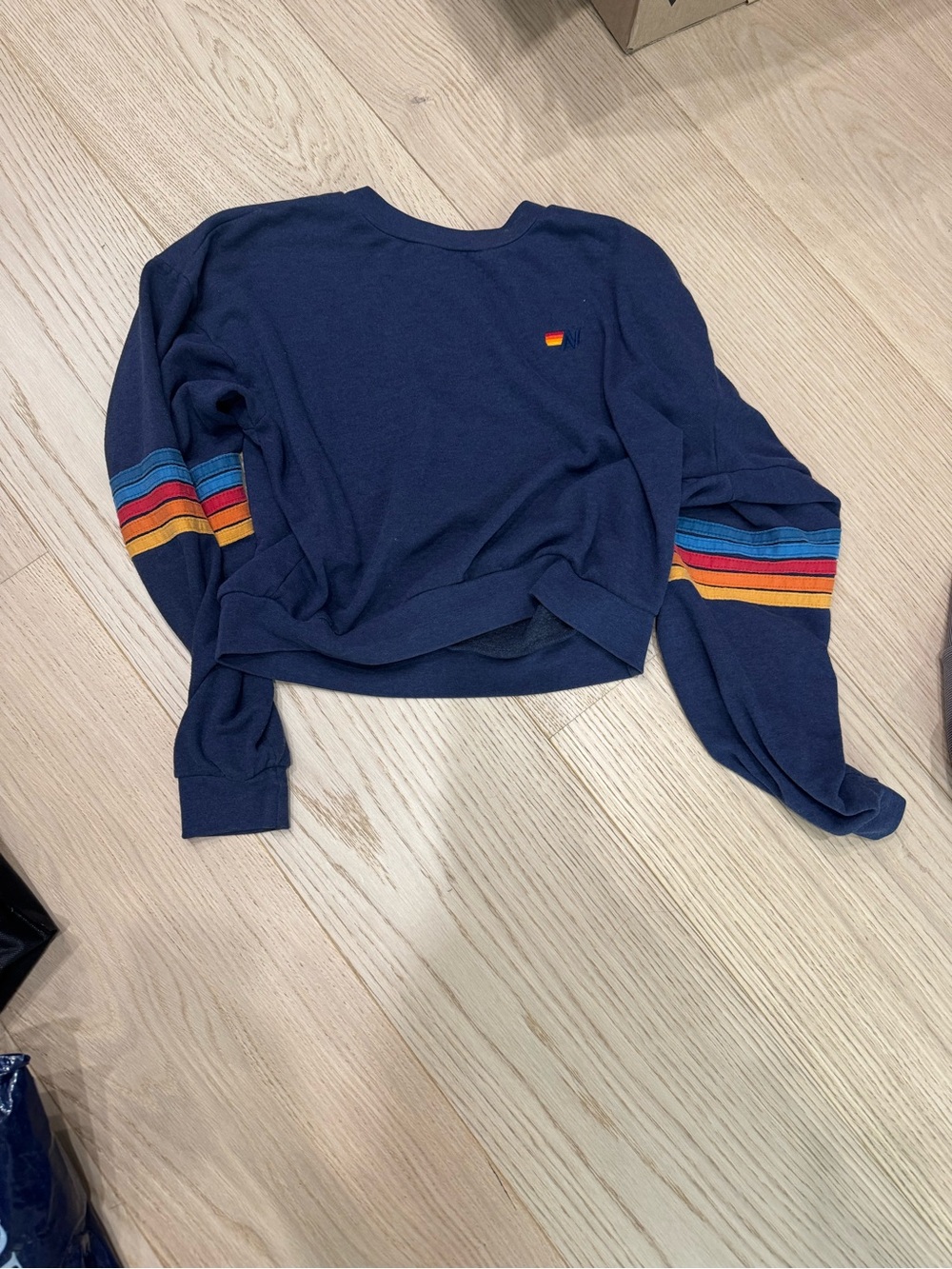 Aviator Nation navy blue sweatshirt with rainbow sleeves